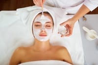 Woman receiving facial skin treatment